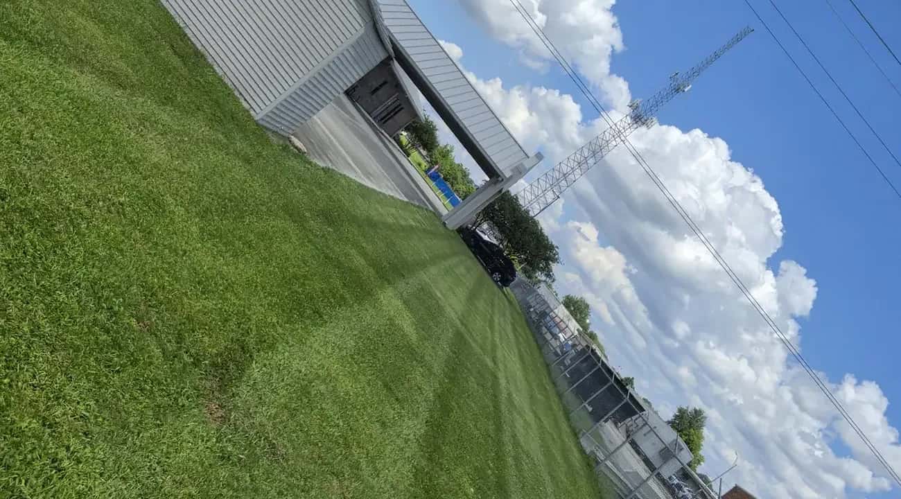 Crisp mowing stripes on the commercial lawn at the RKM location in Baton Rouge, maintained by Southern Buck Lawn